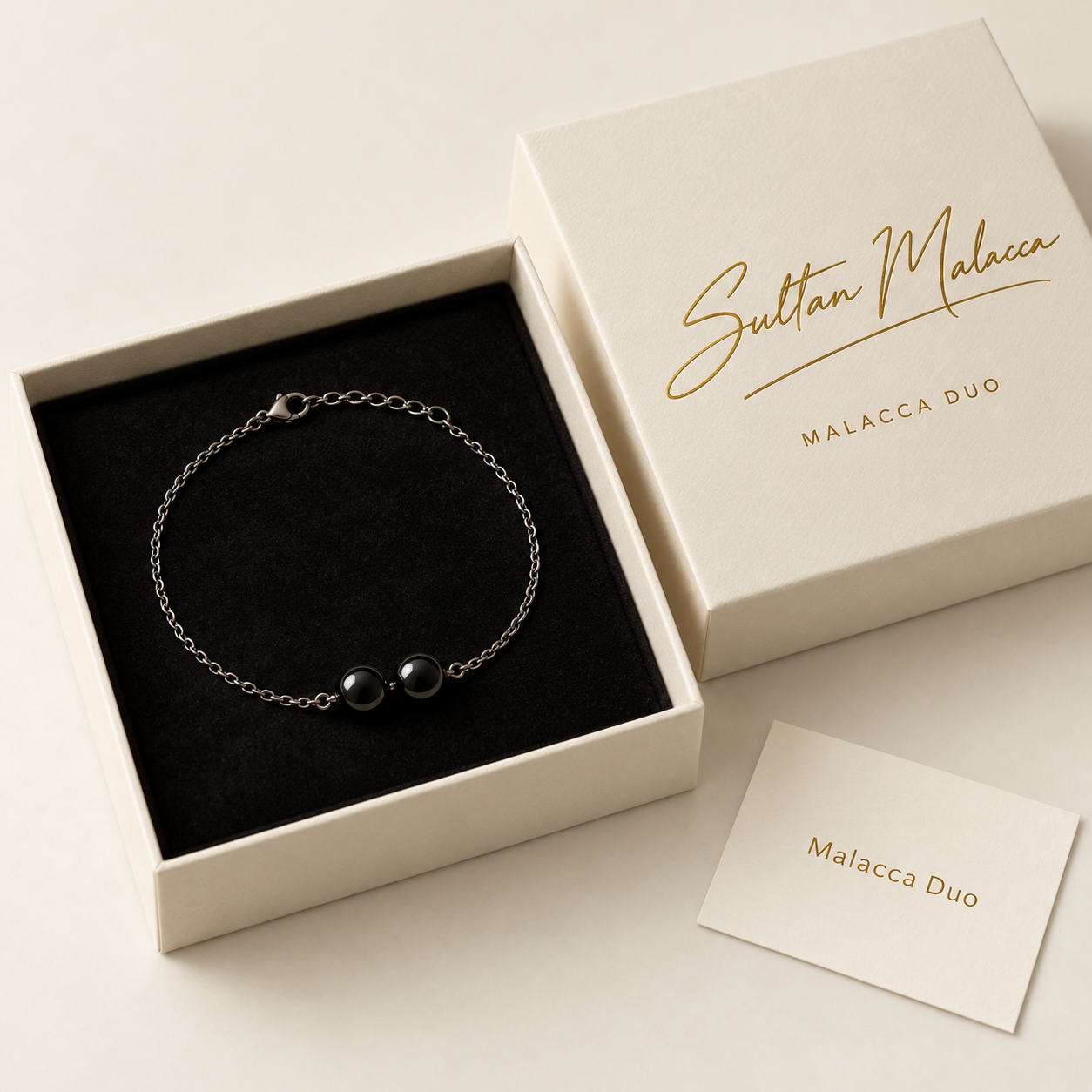 Malacca Duo packaging with gold signature lettering